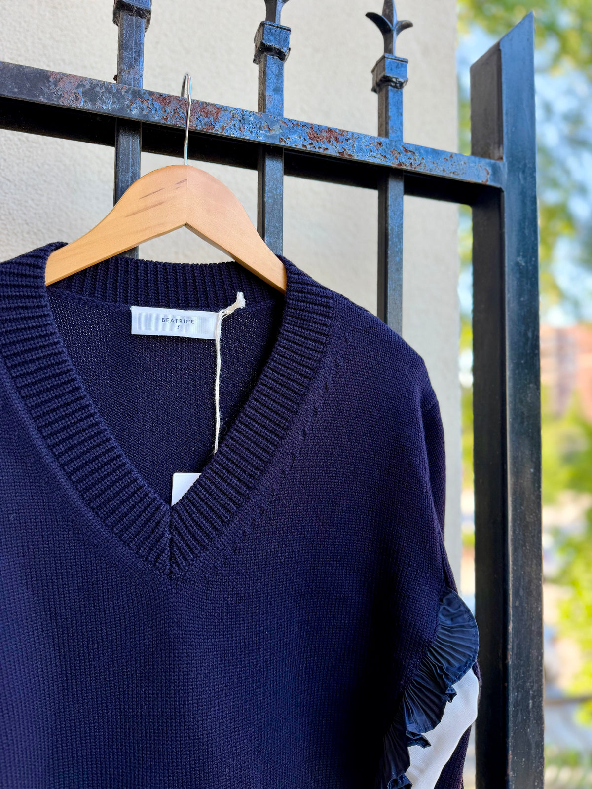 V-Neck Sweater with Ruffle Details and Layered Hem in Dark Blue