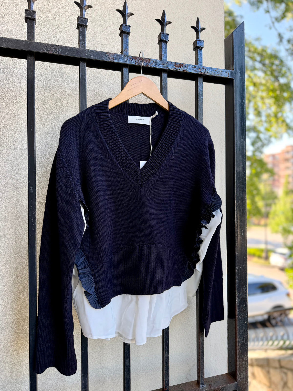 V-Neck Sweater with Ruffle Details and Layered Hem in Dark Blue