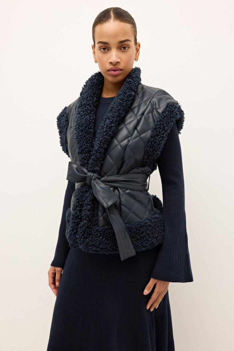 855-306B-108-marie-oliver-beatrice-quilted-vegan-leather-vest-with-sherpa-naval-1