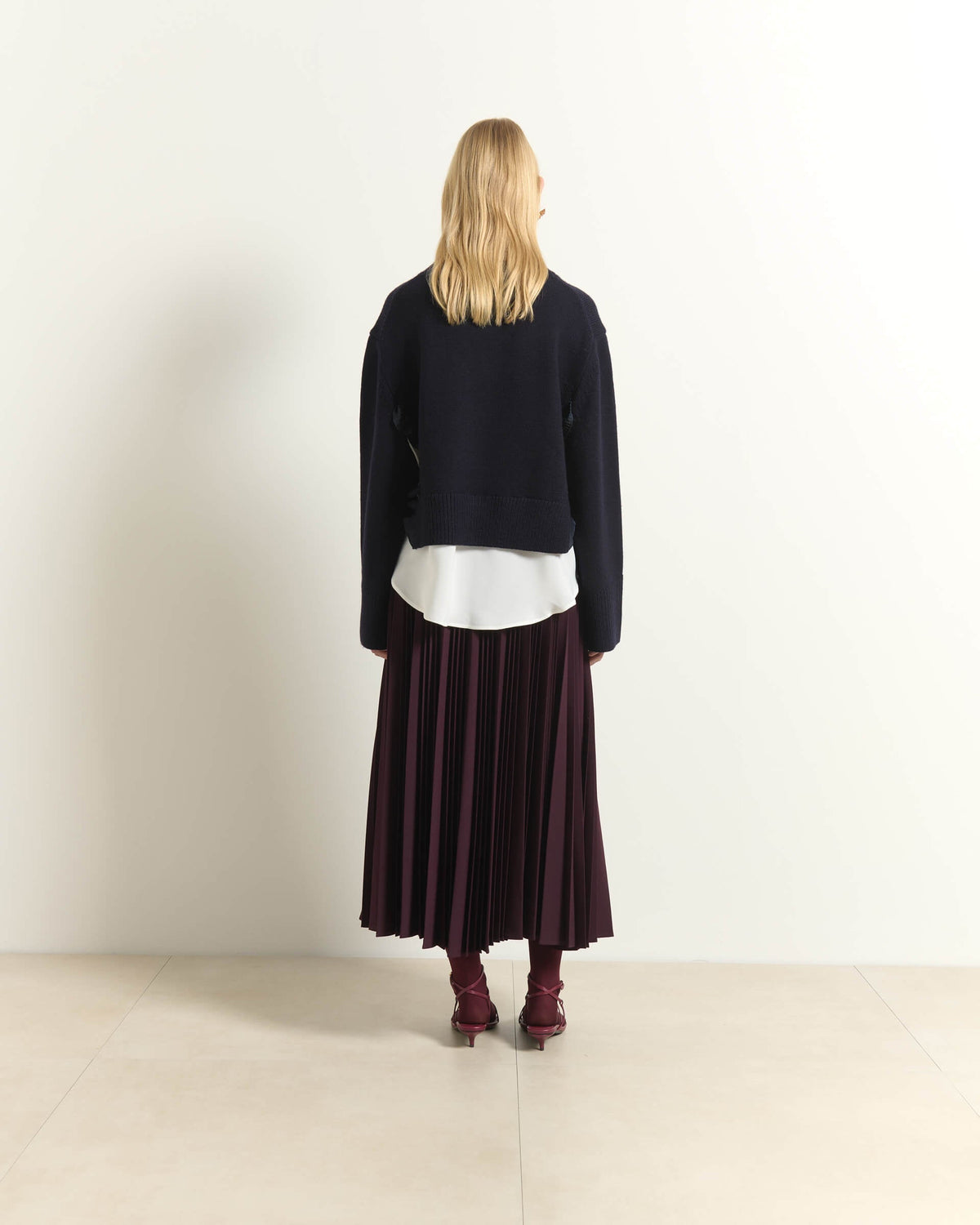 AB2C8760ROUCHES-beatrice-v-neck-sweater-with-ruffle-details-and-layered-hem-in-dark-blue-1