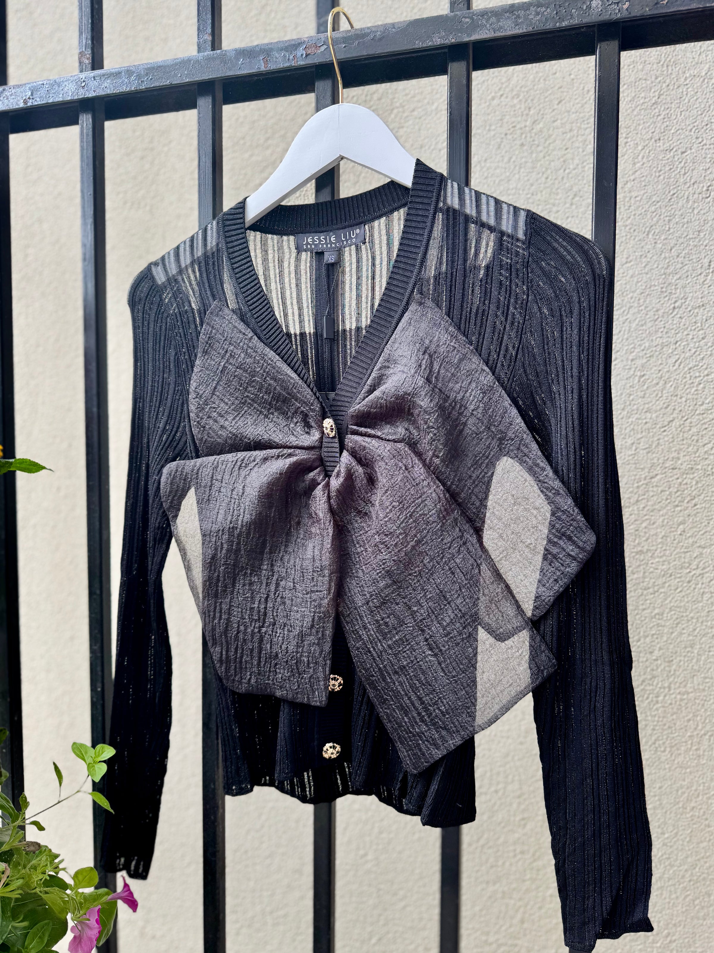 FW25B270-jessie-lui-rib-knit-sheer-knit-top-bow-detail-black-1