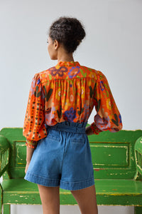 I87S72-hope-for-flowers-smocked-tie-neck-top-in-flame-embroidered-floral-1